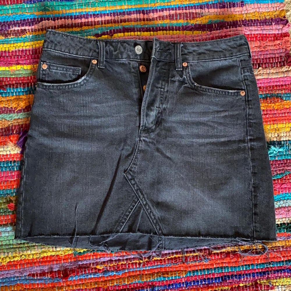 Distressed black denim skirt